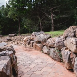 backyard boulder retaining wall service in Edmond Oklahoma