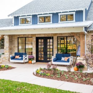 Front porch landscaping with perennials, annuals, shrubs and potted mums