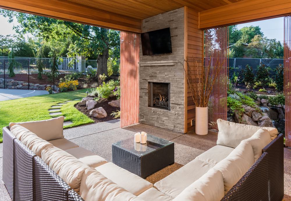 covered patio with fireplace