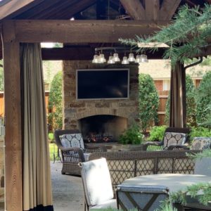 Outdoor bar and fireplace with lighting for guests