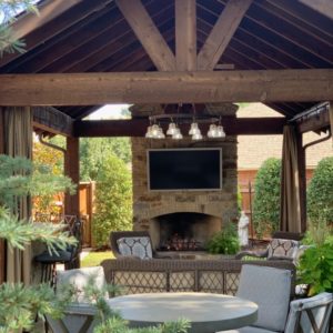 Custom Pavilion and Outdoor Fireplace with wet bar and lighting