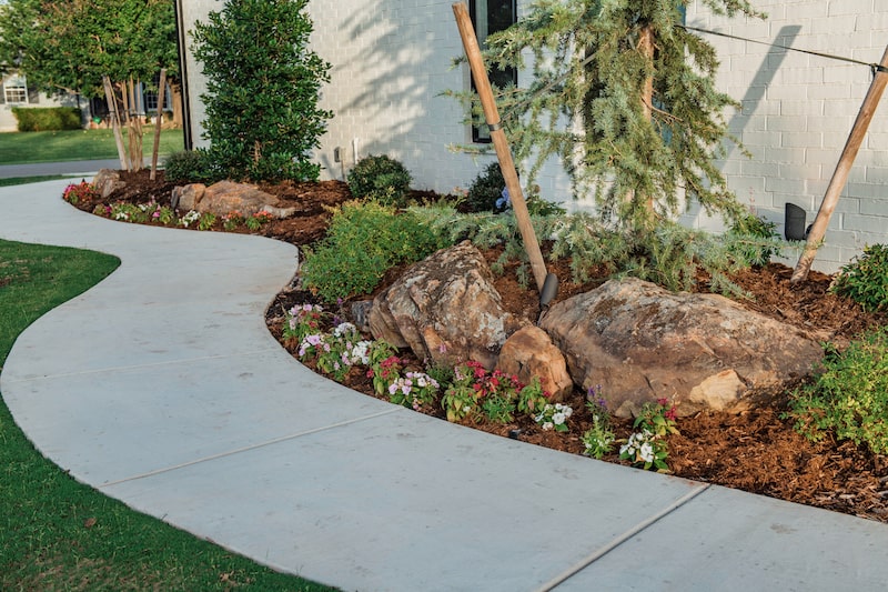 Landscape with boulders in OKC by Nelson Landscaping