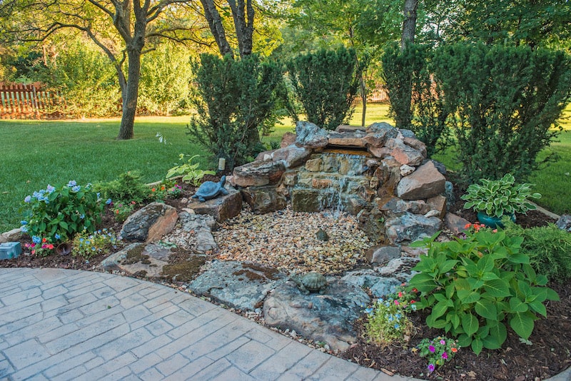 Rock and boulder water feature by Nelson Landscaping in Oklahoma