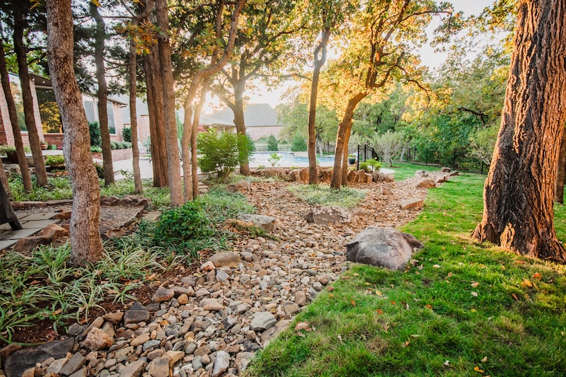 Backyard dry creek riverbed in OKC by Nelson Landscaping